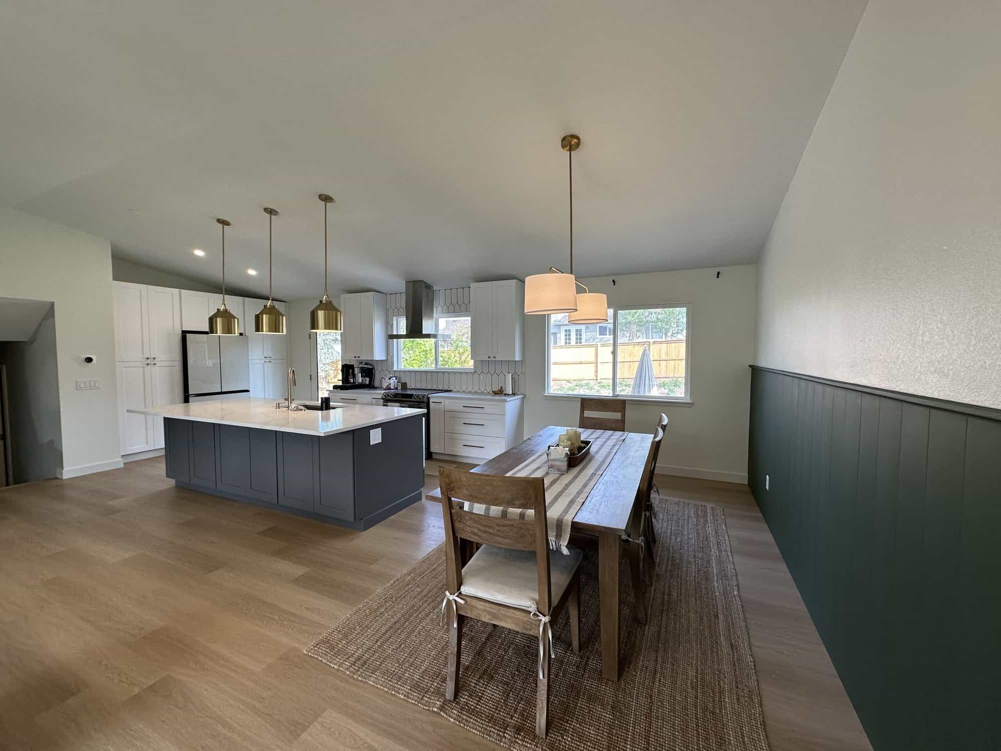 kitchen-and-dining-painted-counter-island-to-grey.jpg a kitchen and dining room with a table and chairs, painted in grey white - premium paint